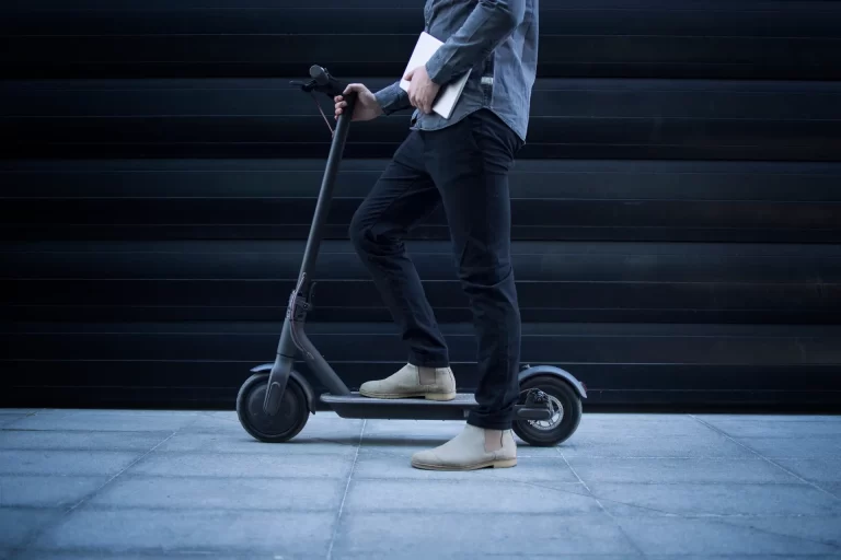 business-person-with-tablet-computer-his-electric-scooter-commuting-vehicle